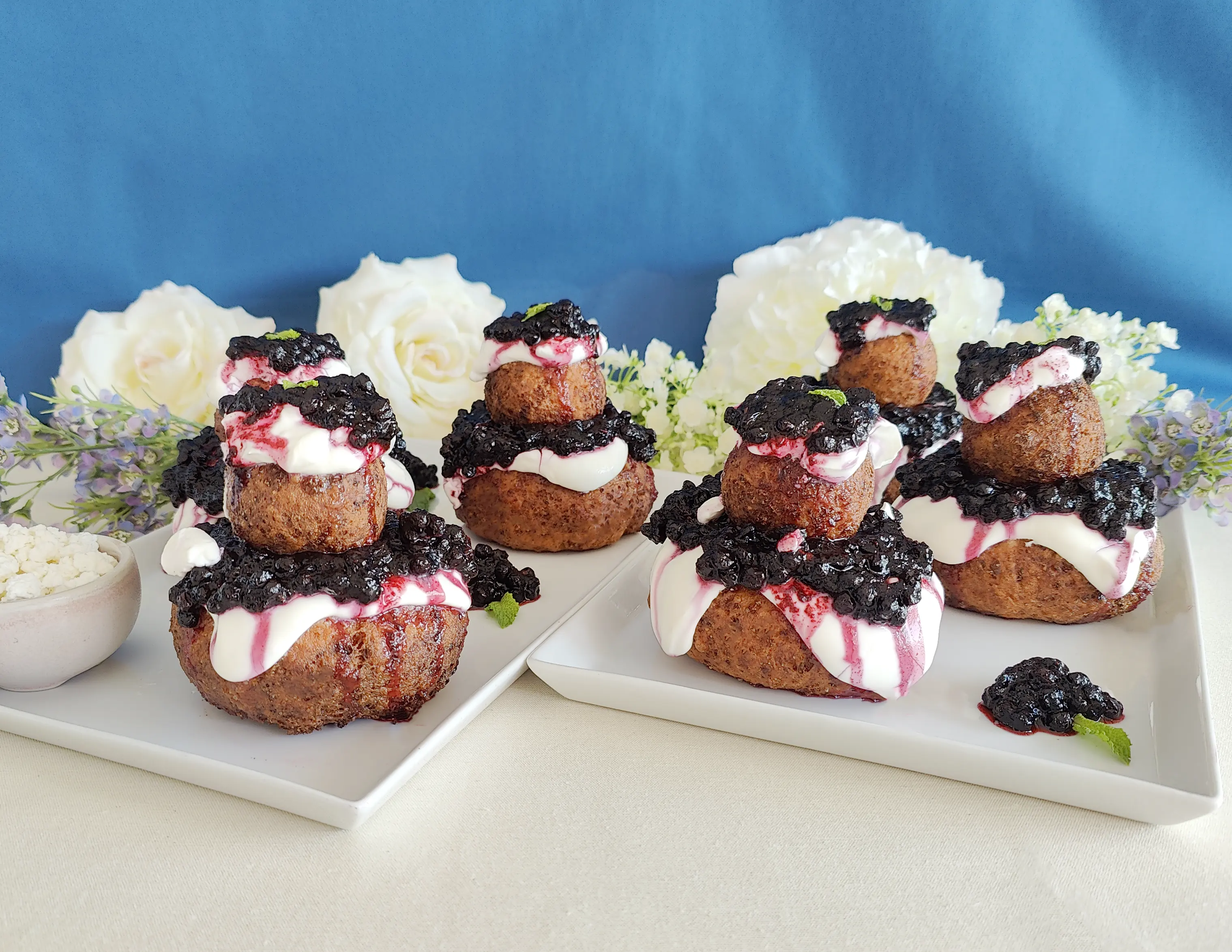 Papanasi with sour cream and blueberry jam